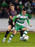 16 February 2024; Darragh Burns of Shamrock Rovers in action against Zak Bradshaw of Dundalk during the SSE Airtricity Men's Premier Division match between Shamrock Rovers and Dundalk at Tallaght Stadium in Dublin. Photo by Stephen McCarthy/Sportsfile