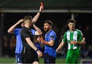 16 February 2024; Alex Dunne of UCD is shown a red card by referee Oliver Moran during the SSE Airtricity Men's First Division match between Bray Wanderers and UCD at Carlisle Grounds in Bray, Wicklow. Photo by Tyler Miller/Sportsfile