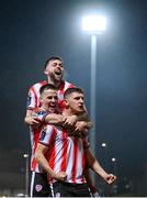16 February 2024; Ronan Boyce of Derry City celebrates with Ben Doherty and Will Patching after scoring their side's first goal during the SSE Airtricity Men's Premier Division match between Derry City and Drogheda United at The Ryan McBride Brandywell Stadium in Derry. Photo by Ramsey Cardy/Sportsfile