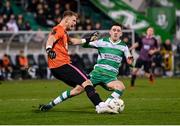 16 February 2024; Dundalk goalkeeper George Shelvey in action against Darragh Burns of Shamrock Rovers during the SSE Airtricity Men's Premier Division match between Shamrock Rovers and Dundalk at Tallaght Stadium in Dublin. Photo by Stephen McCarthy/Sportsfile