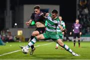 16 February 2024; Jamie Gullan of Dundalk in action against Josh Honohan of Shamrock Rovers during the SSE Airtricity Men's Premier Division match between Shamrock Rovers and Dundalk at Tallaght Stadium in Dublin. Photo by Ben McShane/Sportsfile