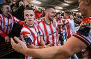 16 February 2024; Ben Doherty, left, and Michael Duffy of Derry City celebrate their side's second goal, scored by Patrick Hoban, during the SSE Airtricity Men's Premier Division match between Derry City and Drogheda United at The Ryan McBride Brandywell Stadium in Derry. Photo by Ramsey Cardy/Sportsfile
