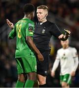 16 February 2024; Referee Daniel Murphy spaks o Samuel Aladesanusi of Kerry FC before issuing him a yellow card during the SSE Airtricity Men's First Division match between Cork City and Kerry FC at Turner's Cross in Cork. Photo by Brendan Moran/Sportsfile
