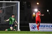 16 February 2024; Sean Boyd of Shelbourne shoots to score his side's first goal past Waterford goalkeeper Sam Sargeant during the SSE Airtricity Men's Premier Division match between Waterford and Shelbourne at the Regional Sports Centre in Waterford. Photo by Harry Murphy/Sportsfile