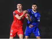 16 February 2024; Sean Boyd of Shelbourne and Grant Horton of Waterford tussle before Sean Boyd of Shelbourne is shown a red card during the SSE Airtricity Men's Premier Division match between Waterford and Shelbourne at the Regional Sports Centre in Waterford. Photo by Harry Murphy/Sportsfile
