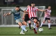 16 February 2024; Hayden Cann of Drogheda United in action against Patrick Hoban of Derry City during the SSE Airtricity Men's Premier Division match between Derry City and Drogheda United at The Ryan McBride Brandywell Stadium in Derry. Photo by Ramsey Cardy/Sportsfile