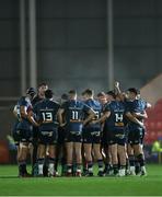 16 February 2024; The Munster team in a huddle during the United Rugby Championship match between Scarlets and Munster at Parc y Scarlets in Llanelli, Wales. Photo by Chris Fairweather/Sportsfile