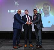 16 February 2024; Robert Delaney from Mullingar Cricket Club is presented with Club Coach of the Year by Arun Kumar and Yogesh Kashyap from Sports Hub during the 12th Business Plus Irish Cricket Awards 2024 at Clontarf Castle Hotel in Dublin. Photo by Matt Browne/Sportsfile