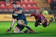 16 February 2024; Tom Ahern of Munster scores a try despite the tackle of Efan Jones of Scarlets during the United Rugby Championship match between Scarlets and Munster at Parc y Scarlets in Llanelli, Wales. Photo by Gruffydd Thomas/Sportsfile