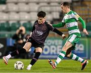 16 February 2024; Ryan O'Kane of Dundalk in action against Sean Kavanagh of Shamrock Rovers during the SSE Airtricity Men's Premier Division match between Shamrock Rovers and Dundalk at Tallaght Stadium in Dublin. Photo by Stephen McCarthy/Sportsfile