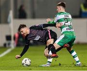 16 February 2024; Archie Davies of Dundalk is tackled by Darragh Burns of Shamrock Rovers during the SSE Airtricity Men's Premier Division match between Shamrock Rovers and Dundalk at Tallaght Stadium in Dublin. Photo by Stephen McCarthy/Sportsfile