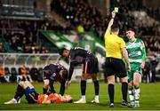 16 February 2024; Darragh Burns of Shamrock Rovers is shown a yellow card by referee Rob Hennessy during the SSE Airtricity Men's Premier Division match between Shamrock Rovers and Dundalk at Tallaght Stadium in Dublin. Photo by Stephen McCarthy/Sportsfile