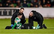 16 February 2024; Trevor Clarke of Shamrock Rovers receives medical attention from physiotherapist Tony McCarthy, right, and team doctor Connor Gallagher during the SSE Airtricity Men's Premier Division match between Shamrock Rovers and Dundalk at Tallaght Stadium in Dublin. Photo by Stephen McCarthy/Sportsfile