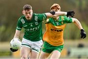 17 February 2024; Oisin Smyth of Fermanagh in action against Ciarán Moore of Donegal during the Allianz Football League Division 2 match between Donegal and Fermanagh at O'Donnell Park in Letterkenny, Donegal. Photo by Ramsey Cardy/Sportsfile