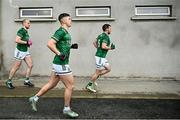 17 February 2024; Fermanagh players, from left, Ché Cullen, Sean Cassidy and captain Declan McCusker run out before the Allianz Football League Division 2 match between Donegal and Fermanagh at O'Donnell Park in Letterkenny, Donegal.  Photo by Ramsey Cardy/Sportsfile