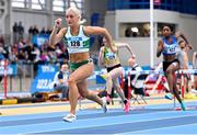 17 February 2024; Sarah Lavin of Emerald AC, Limerick, on her way to winning the senior women's 60m hurdles heats during day one of the 123.ie National Senior Indoor Championships at the Sport Ireland National Indoor Arena in Dublin. Photo by Tyler Miller/Sportsfile