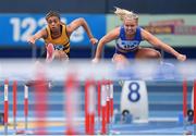 17 February 2024; Okwu Backari of Leevale AC, Cork, left, and Molly Scott of St Laurence O'Toole AC, Dublin, competing in the senior women's 60m hurdles heats during day one of the 123.ie National Senior Indoor Championships at the Sport Ireland National Indoor Arena in Dublin. Photo by Tyler Miller/Sportsfile