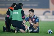 16 February 2024; Conor Murray of Munster receives medical attention during the United Rugby Championship match between Scarlets and Munster at Parc y Scarlets in Llanelli, Wales. Photo by Gruffydd Thomas/Sportsfile
