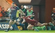 16 February 2024; Sean O’Brien of Munster evades the tackle of Eddie James of Scarlets during the United Rugby Championship match between Scarlets and Munster at Parc y Scarlets in Llanelli, Wales. Photo by Gruffydd Thomas/Sportsfile