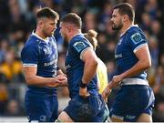 17 February 2024; Scott Penny of Leinster, centre, celebrates with teammates Ross Byrne and Max Deegan after scoring his side's first try during the United Rugby Championship match between Leinster and Benetton at the RDS Arena in Dublin. Photo by Harry Murphy/Sportsfile