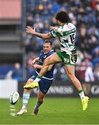 17 February 2024; Liam Turner of Leinster kicks past Jacob Umaga of Benetton during the United Rugby Championship match between Leinster and Benetton at the RDS Arena in Dublin. Photo by Ben McShane/Sportsfile