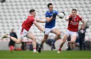17 February 2024; Gerard Smith of Cavan in action against Rory Maguire, left, and Luke Fahy of Cork during the Allianz Football League Division 2 match between Cork and Cavan at SuperValu Páirc Ui Chaoimh in Cork. Photo by Piaras Ó Mídheach/Sportsfile