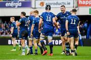 17 February 2024; Leinster players, including Ross Molony, second from right, celebrate with Brian Deeny, 19, after he scored their side's sixth try during the United Rugby Championship match between Leinster and Benetton at the RDS Arena in Dublin. Photo by Ben McShane/Sportsfile