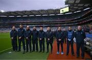 17 February 2024; Sean Murphy, backroom,  Brian O’Regan, selector, Mick Galvin, selector, Ger Lyons, selector, Darren Daly, selector, Dessie Farrell, Dublin manager, Séamus McCormack, Media Manager, Dr Diarmuid Smyth, James Allen, Chartered Physiotherapist during a minutes silence in memory of the late Dublin selector Shane O'Hanlon before the Allianz Football League Division 1 match between Dublin and Roscommon at Croke Park in Dublin. Photo by Ray McManus/Sportsfile