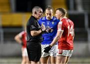 17 February 2024; Referee Brendan Griffin speaks to Padraig Faulkner of Cavan and Brian Hurley of Cork before showing each the yellow card during the Allianz Football League Division 2 match between Cork and Cavan at SuperValu Páirc Ui Chaoimh in Cork. Photo by Piaras Ó Mídheach/Sportsfile