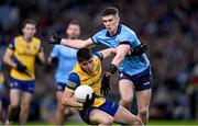 17 February 2024; Niall Higgins of Roscommon is tackled by Lee Gannon of Dublin during the Allianz Football League Division 1 match between Dublin and Roscommon at Croke Park in Dublin. Photo by Ray McManus/Sportsfile