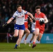 17 February 2024; Eoin McEvoy of Derry in action against Kieran Duffy of Monaghan during the Allianz Football League Division 1 match between Derry and Monaghan at Celtic Park in Derry. Photo by Ramsey Cardy/Sportsfile