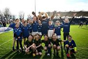 17 February 2024; The St Mary's College and Railway Union team with Leo the Lion before the Bank of Ireland Half-Time Minis at the United Rugby Championship match between Leinster and Benetton at RDS Arena in Dublin. Photo by Harry Murphy/Sportsfile