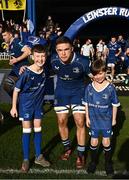 17 February 2024; Leinster captain Scott Penny walks out with Matchday mascots Eoin Sheridan, aged 10, and Sean Cullinan, aged seven, before the United Rugby Championship match between Leinster and Benetton at RDS Arena in Dublin. Photo by Harry Murphy/Sportsfile