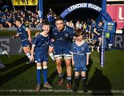 17 February 2024; Leinster captain Scott Penny walks out with Matchday mascots Eoin Sheridan, aged 10, and Sean Cullinan, aged seven, before the United Rugby Championship match between Leinster and Benetton at RDS Arena in Dublin. Photo by Harry Murphy/Sportsfile