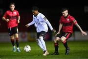 17 February 2024; Mark Mbuli of Finn Harps in action against Kyle O'Connor of Longford Town during the SSE Airtricity Men's First Division match between Longford Town and Finn Harps at Bishopsgate in Longford. Photo by Stephen McCarthy/Sportsfile