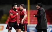 17 February 2024; Chris Lyons of Longford Town celebrates after scoring his, and his side's, second goal with team-mate Adam Wixted, left, and manager Stephen Hendersonduring the SSE Airtricity Men's First Division match between Longford Town and Finn Harps at Bishopsgate in Longford. Photo by Stephen McCarthy/Sportsfile