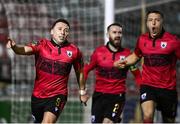 17 February 2024; Chris Lyons of Longford Town celebrates after scoring his side's first goal with team-mates Luke Wade-Slater and Jamie Egan, right, during the SSE Airtricity Men's First Division match between Longford Town and Finn Harps at Bishopsgate in Longford. Photo by Stephen McCarthy/Sportsfile