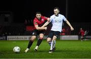 17 February 2024; David Cawley of Finn Harps in action against Chris Lyons of Longford Town during the SSE Airtricity Men's First Division match between Longford Town and Finn Harps at Bishopsgate in Longford. Photo by Stephen McCarthy/Sportsfile