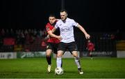 17 February 2024; David Cawley of Finn Harps in action against Chris Lyons of Longford Town during the SSE Airtricity Men's First Division match between Longford Town and Finn Harps at Bishopsgate in Longford. Photo by Stephen McCarthy/Sportsfile