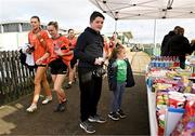 18 February 2024; Armagh players makes their way past the shop to the pitch to warm up before the Lidl LGFA National League Division 1 Round 4 match between Meath and Armagh at Donaghmore Ashbourne GAA Club in Ashbourne, Meath. Photo by Seb Daly/Sportsfile