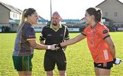 18 February 2024; Referee Eddie Cuthbert with team captains Monica McGuirk of Meath, left, and Clodagh McCambridge of Armagh before the Lidl LGFA National League Division 1 Round 4 match between Meath and Armagh at Donaghmore Ashbourne GAA Club in Ashbourne, Meath. Photo by Seb Daly/Sportsfile