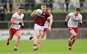 18 February 2024; Johnny Heaney of Galway in action against Michael McKernan, left, and Niall Devlin of Tyrone during the Allianz Football League Division 1 match between Tyrone and Galway at O'Neills Healy Park in Omagh, Tyrone. Photo by Ramsey Cardy/Sportsfile