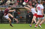 18 February 2024; Conall Devlin of Tyrone blocks John Daly of Galway during the Allianz Football League Division 1 match between Tyrone and Galway at O'Neills Healy Park in Omagh, Tyrone. Photo by Ramsey Cardy/Sportsfile