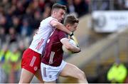 18 February 2024; Johnny McGrath of Galway is tackled by Conn Kilpatrick of Tyrone during the Allianz Football League Division 1 match between Tyrone and Galway at O'Neills Healy Park in Omagh, Tyrone. Photo by Ramsey Cardy/Sportsfile