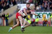 18 February 2024; Johnny McGrath of Galway is tackled by Conn Kilpatrick of Tyrone during the Allianz Football League Division 1 match between Tyrone and Galway at O'Neills Healy Park in Omagh, Tyrone. Photo by Ramsey Cardy/Sportsfile