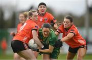 18 February 2024; Niamh Gallogly of Meath in action against Armagh players Aoife McCoy, left, and Corinna Doyle during the Lidl LGFA National League Division 1 Round 4 match between Meath and Armagh at Donaghmore Ashbourne GAA Club in Ashbourne, Meath. Photo by Seb Daly/Sportsfile