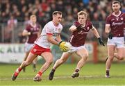 18 February 2024; Darragh Canavan of Tyrone in action against Johnny McGrath of Galway during the Allianz Football League Division 1 match between Tyrone and Galway at O'Neills Healy Park in Omagh, Tyrone. Photo by Ramsey Cardy/Sportsfile