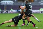 18 February 2024; Mike Lowry of Ulster is tackled by Keiran Williams and Evardi Boshoff of Ospreys during the United Rugby Championship match between Ospreys and Ulster at Swansea.com Stadium in Swansea, Wales. Photo by Gareth Everett/Sportsfile