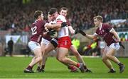 18 February 2024; Michael McGleenan of Tyrone under pressure from Galway players, from left, Cathal Sweeney, Dylan McHugh, Céin Darcy and Johnny McGrath during the Allianz Football League Division 1 match between Tyrone and Galway at O'Neills Healy Park in Omagh, Tyrone. Photo by Ramsey Cardy/Sportsfile