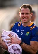 18 February 2024; Dean Healy of Wicklow with his four day old daughter, Aifric, after  the Allianz Football League Division 3 match between Wicklow and Westmeath at Echelon Park in Aughrim, Wicklow. Photo by Ray McManus/Sportsfile